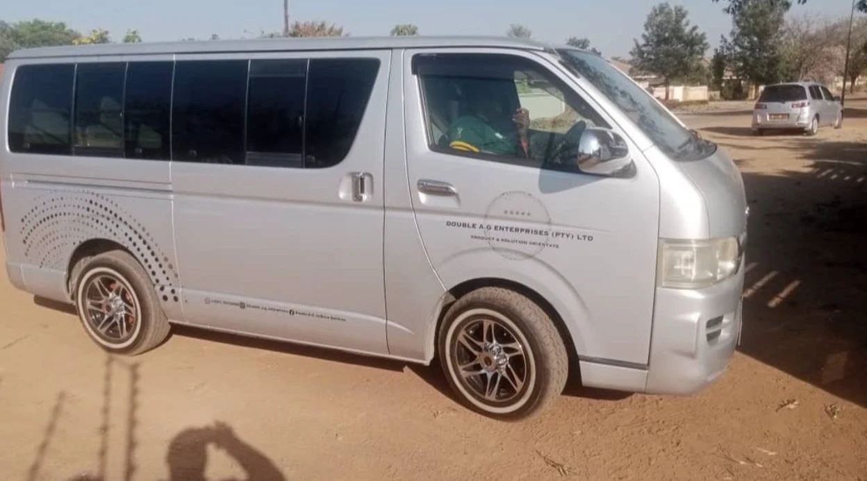 Silver Toyota HiAce van in Double A. G branding