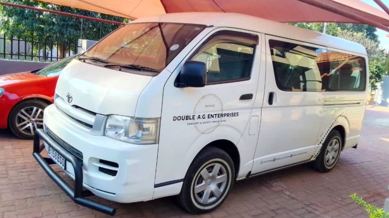 White Toyota HiAce van in Double A. G branding