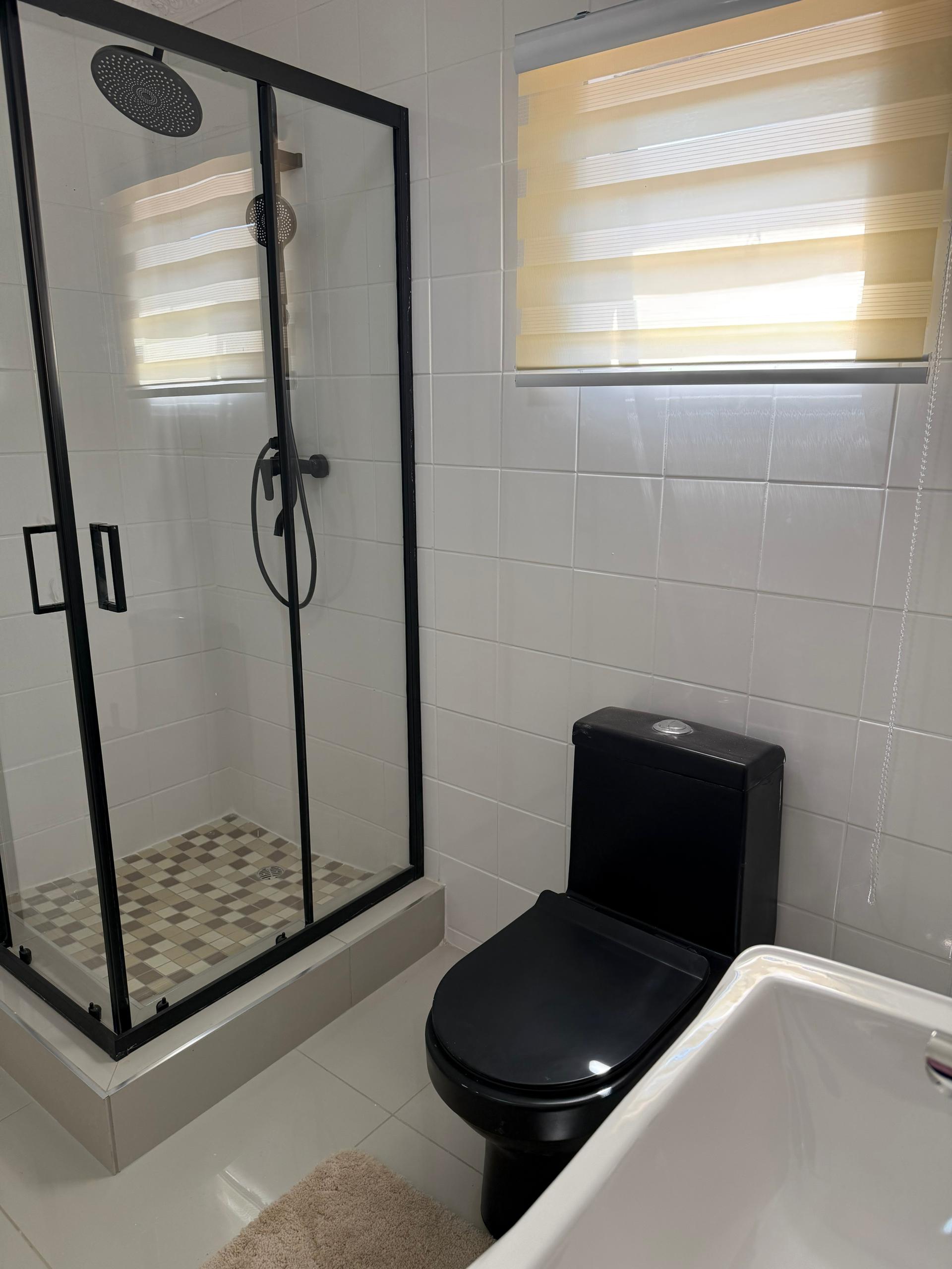 Bathroom with glass shower and toilet